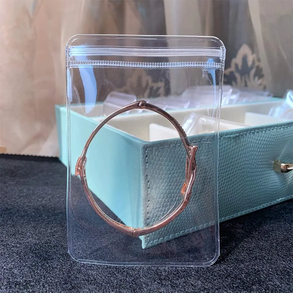 100 Pack PVC Clear Jewelry Anti Oxidation Zipper Bag Antitarnish Plastic Bags for Packaging Jewelry Rings Earrings Transparent Poly Pouch (Light Blue, 2.363.14inch)