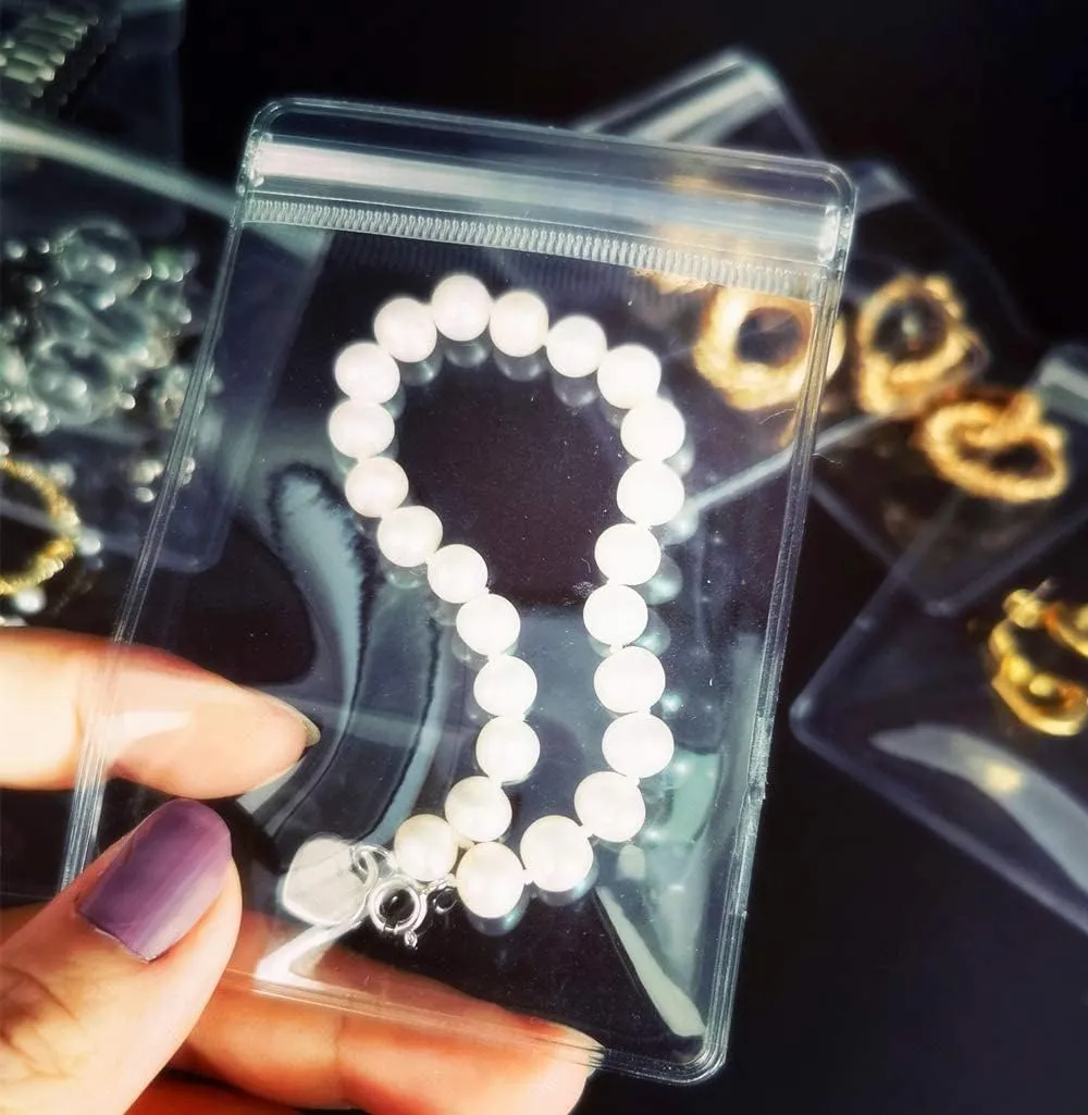 NATX 100pcs Clear PVC Transparent Zip Lock Jewelry Bag Small Size Dust Proof Airtight Pouch Plastic Zipper Self Seal Packing Organizer Storage Bags for Rings Earrings Bracelet (2.36x3.15in)