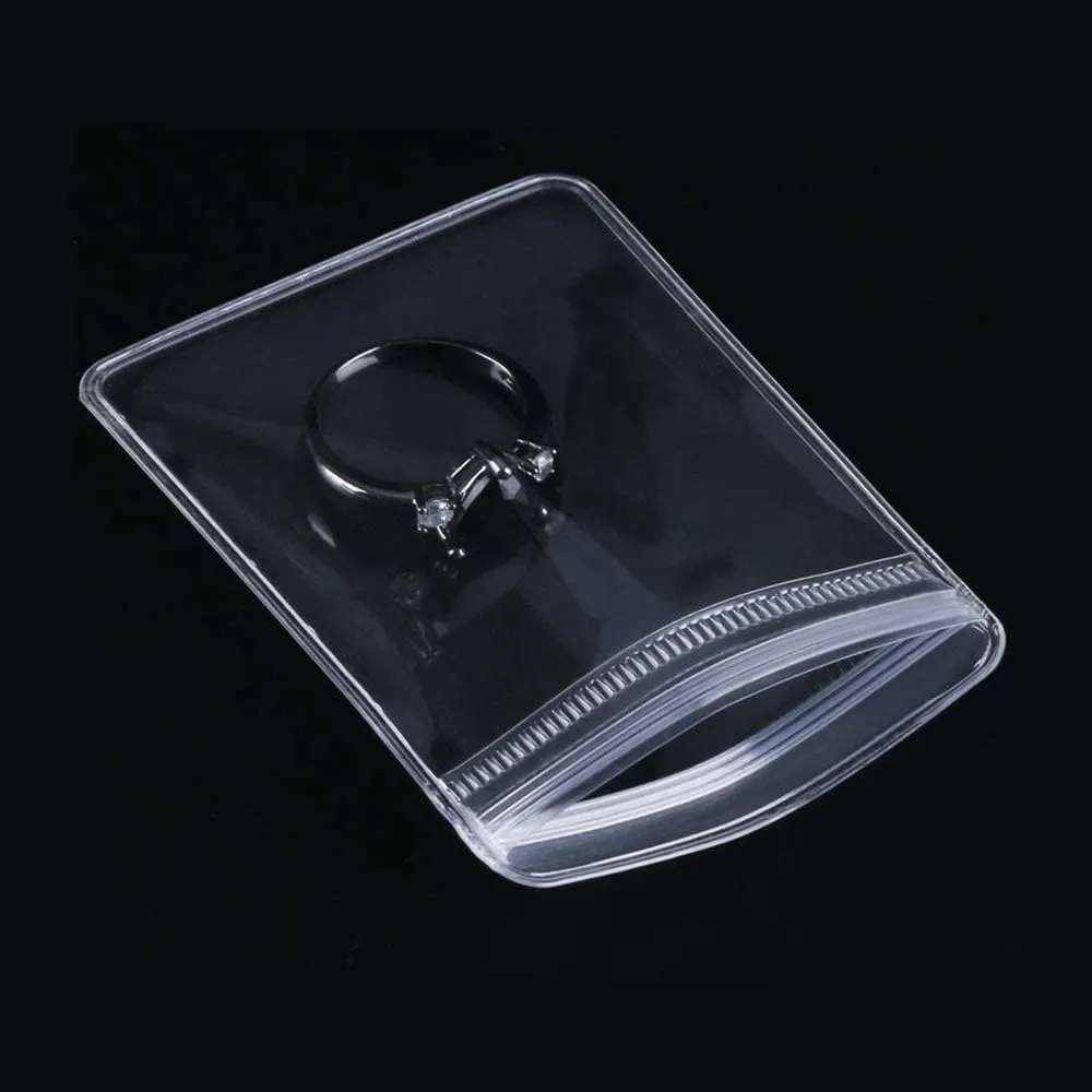 NATX 100pcs Clear PVC Transparent Zip Lock Jewelry Bag Small Size Dust Proof Airtight Pouch Plastic Zipper Self Seal Packing Organizer Storage Bags for Rings Earrings Bracelet (2.36x3.15in)